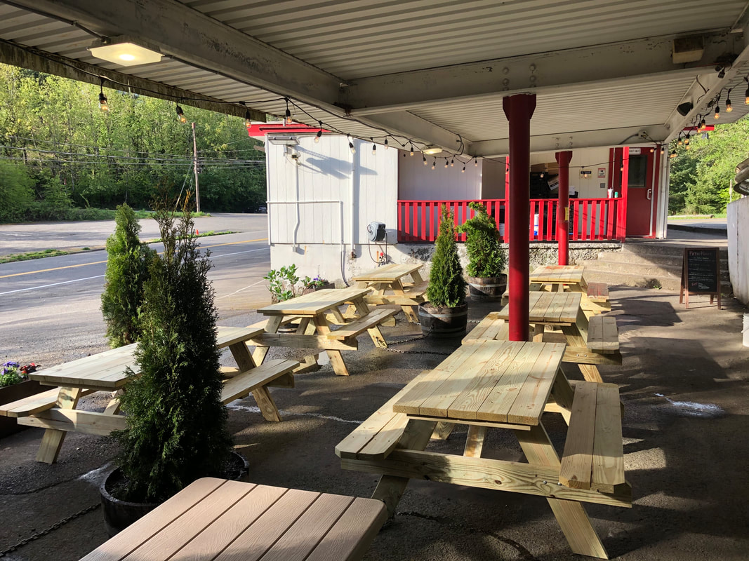 outdoor dining area picnic tables plants